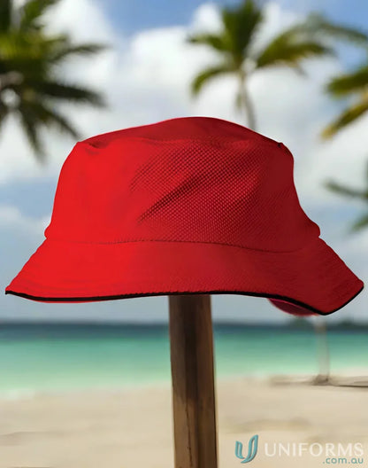 Red mesh bucket hat with sun protection from Winning Spirit Pique collection