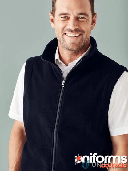 Smiling man in navy blue micro fleece vest from Biz Collection Men’s fleece vest f633mn