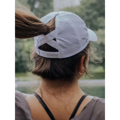 White breathable mesh ponytail active cap with adjustable strap and rear crossband perfect for work uniforms