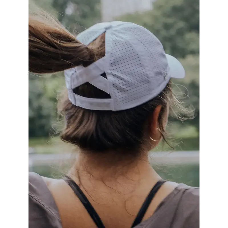 White breathable mesh ponytail active cap with adjustable strap and rear crossband perfect for work uniforms