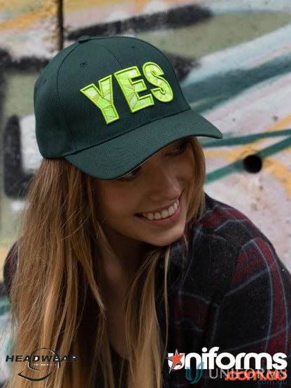 Green baseball cap with YES lettering, premium American twill, fabric-covered touch strap