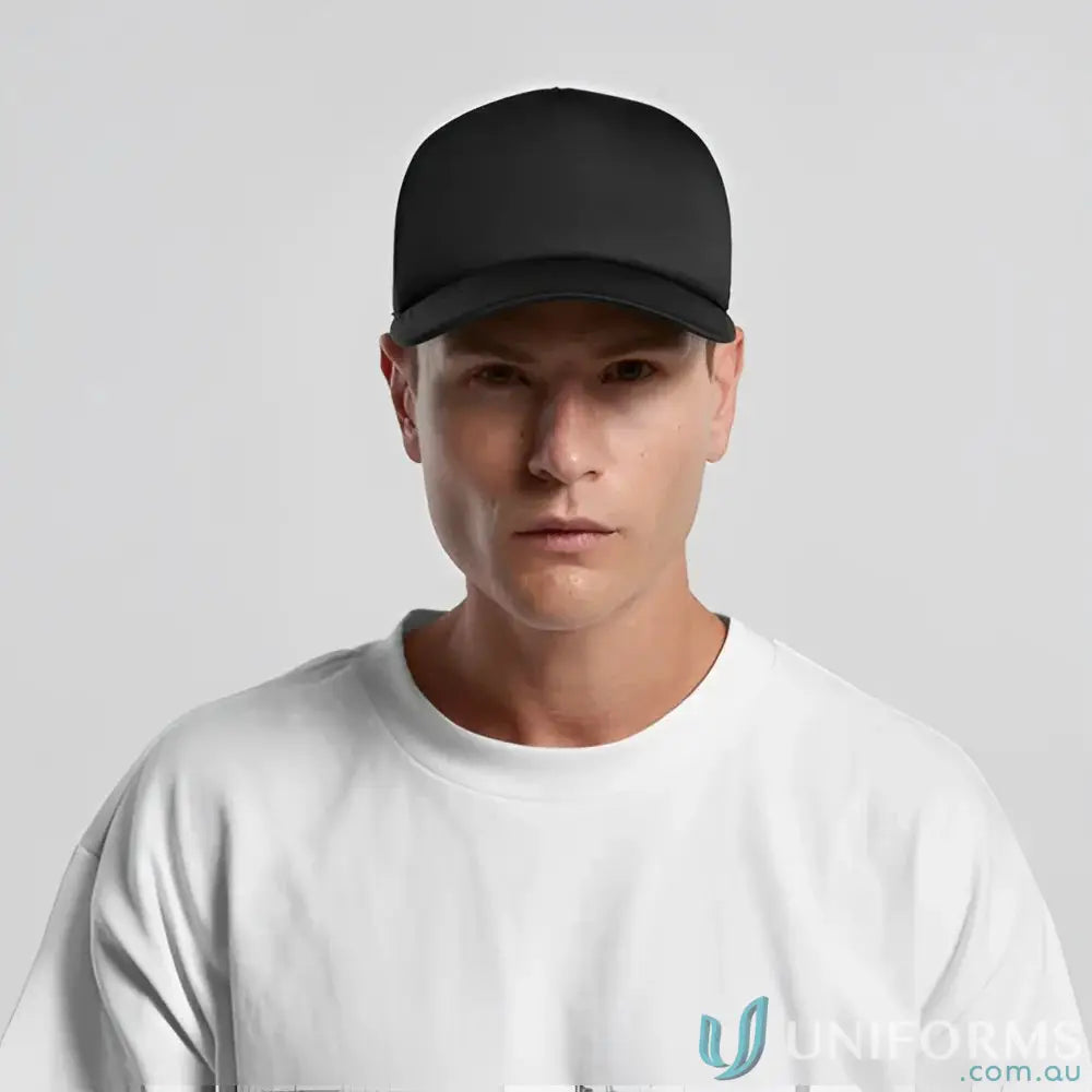 Man wearing a black baseball cap with recycled polyester mesh back and white t-shirt