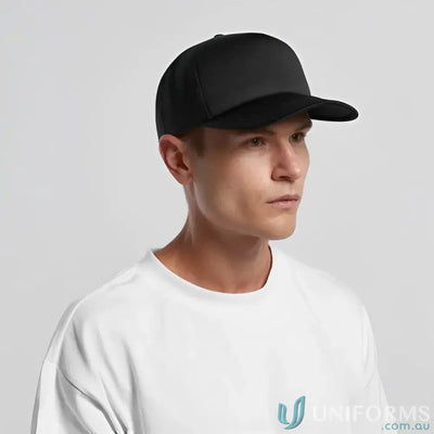 Man wearing black baseball cap with recycled polyester mesh and white tee