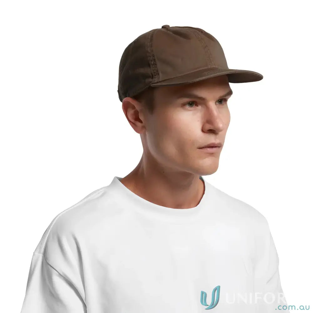 Man in white T-shirt wearing a premium mid-profile cotton cap with flat peak and metal clasp