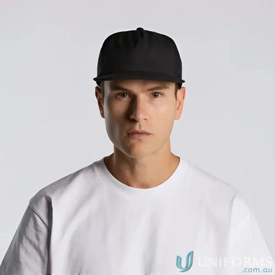 Man wearing black flat-brimmed baseball cap with fleece lining and recycled polyester fabric
