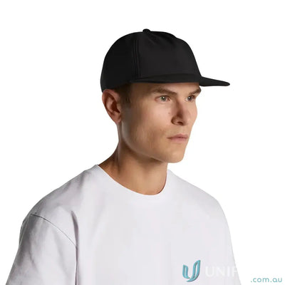Man wearing a black mid-profile five-panel cap with fleece lining and recycled polyester
