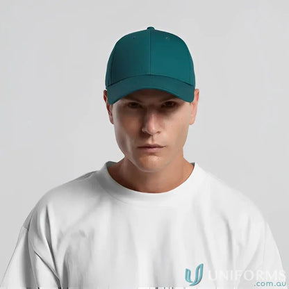 Man wearing teal snapback cap with curved peak and tonal under-peak lining