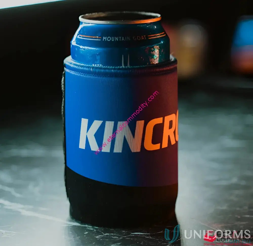 Blue and black insulated magnetic stubby holder with silver and orange logo for beer cooling