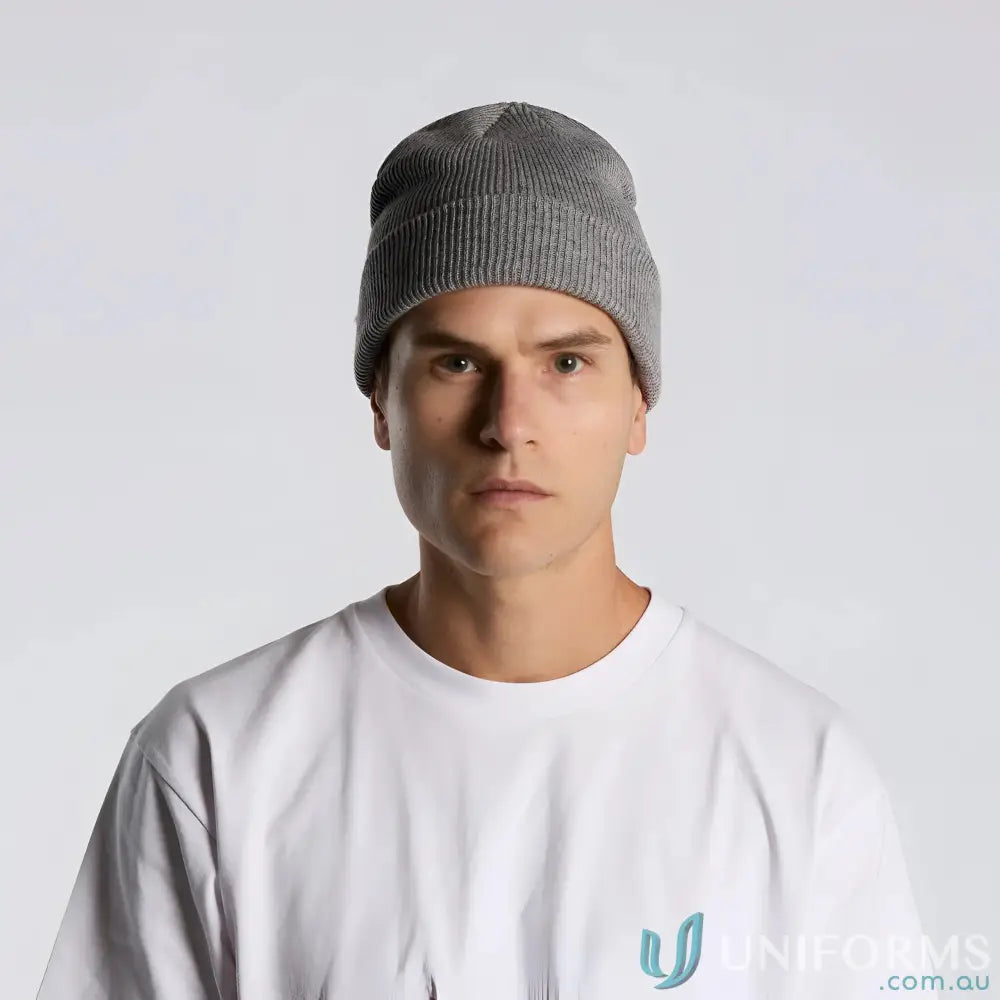 Man wearing a grey ribbed knit beanie and white tee, perfect for cold days
