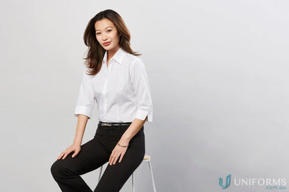 Businesswoman in professional attire wearing Pronto EMB Ladies 3Qtr Shirt workwear