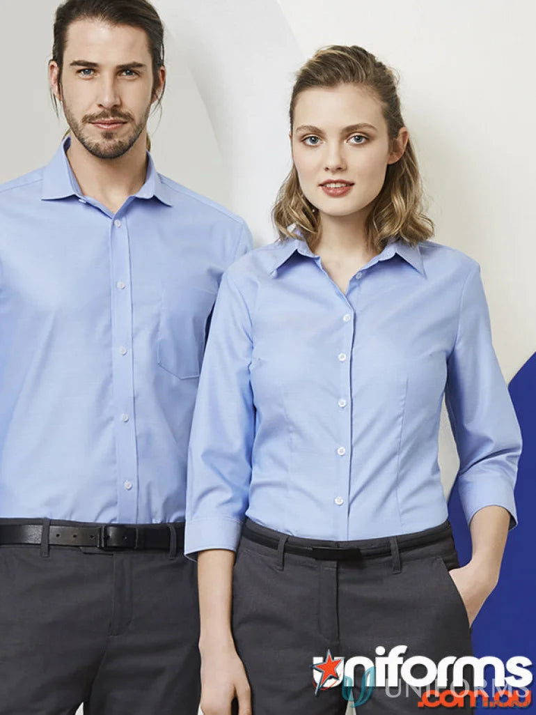 Matching light blue Pronto Ladies Cotton 3Qtr Shirts and dark gray pants for work uniforms