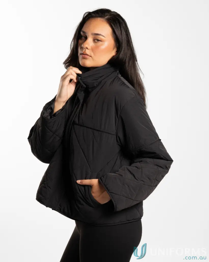 Black quilted puffer jacket with high stand-up collar and internal zip pocket