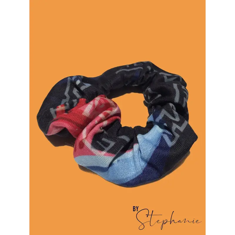 Rainbow scrunchie with bold navy blue red and light blue geometric fabric perfect for adding style to work uniforms