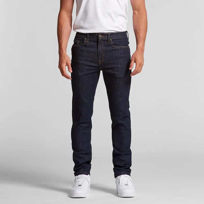 Dark wash slim fit raw indigo denim jeans with white stitching by Target