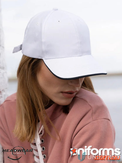 White baseball cap with dark trim from the recycled earth friendly cap collection