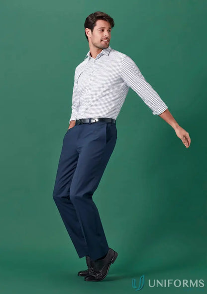Man wearing Renew Adjustable Waist Straight Leg Pant with white patterned shirt and black shoes