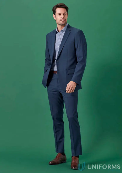 Man in a blue Renew Slim Fit Flat Front Pant made from recycled polyester for corporate settings