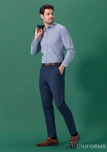Man in dress shirt and slacks wearing Renew Slim Fit flat front pant for corporate setups