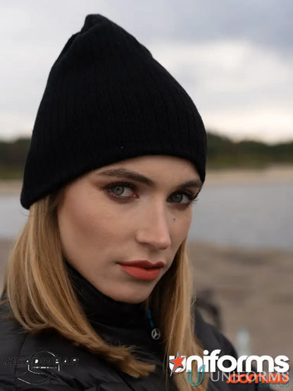 Black knit beanie for uniforms and workwear, featuring cozy cable knit design