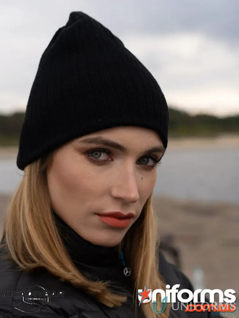 Black knit beanie for uniforms and workwear, featuring cozy cable knit design