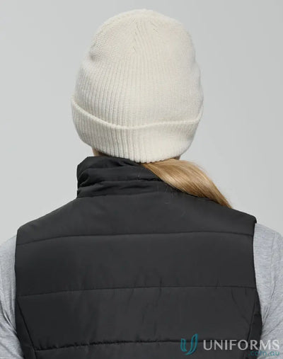 Cream-colored knit snug beanie with cable knit pattern from Winning Spirit Roll