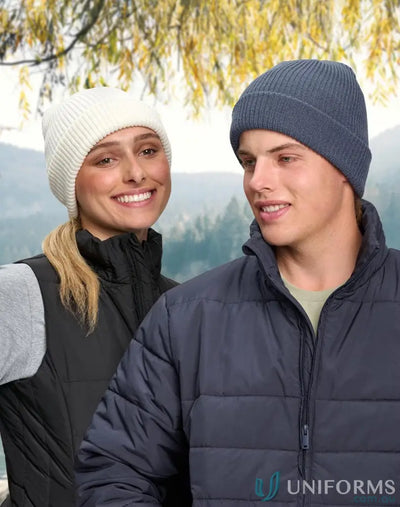 Two people wearing cozy cable knit pattern knit snug beanies with winning spirit roll