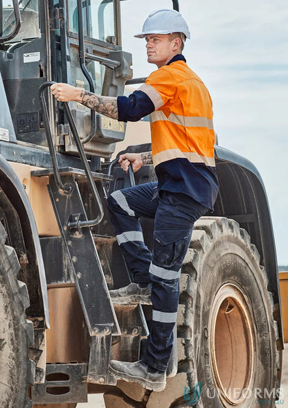 Construction worker climbing machinery wearing Rugged Cooling Stretch Taped Pant with large cargo pockets