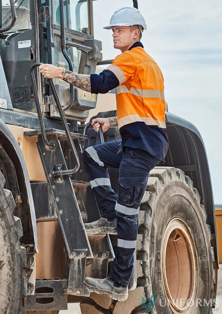 Construction worker climbing machinery wearing Rugged Cooling Stretch Taped Pant with large cargo pockets