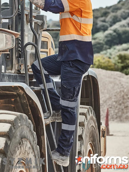 Rugged stretch workwear pants with segmented reflective tape and large cargo pockets