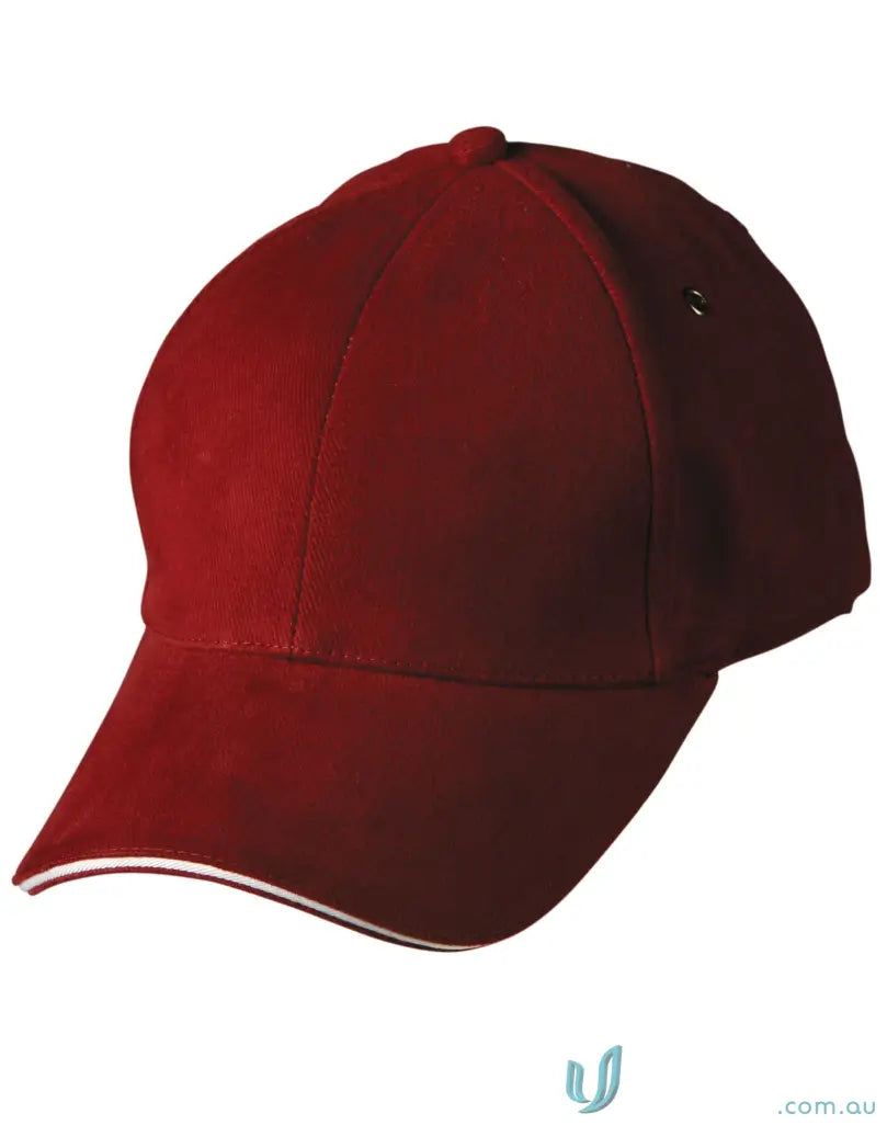 Maroon Sandwich Peak Cap with white trim and tuck-in fabric strap showing winning spirit
