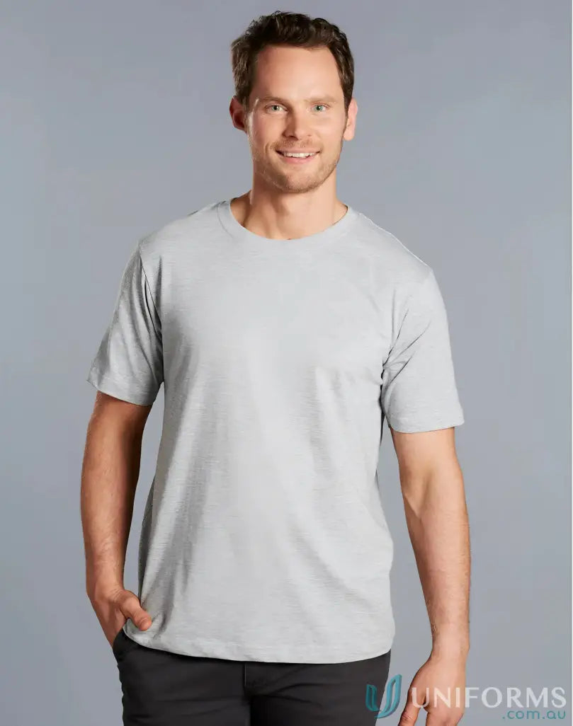 Smiling man in TS37 Savvy Tee with twin stitching, showing winning spirit style