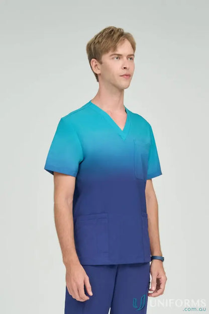 Men’s sea blue inclusive ombre scrub top with matching teal scrub pants from Sea Blue Collection