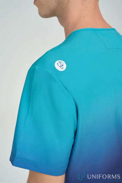 Sea Blue Collection blue inclusive ombre scrub top with white logo for aged care vet practices