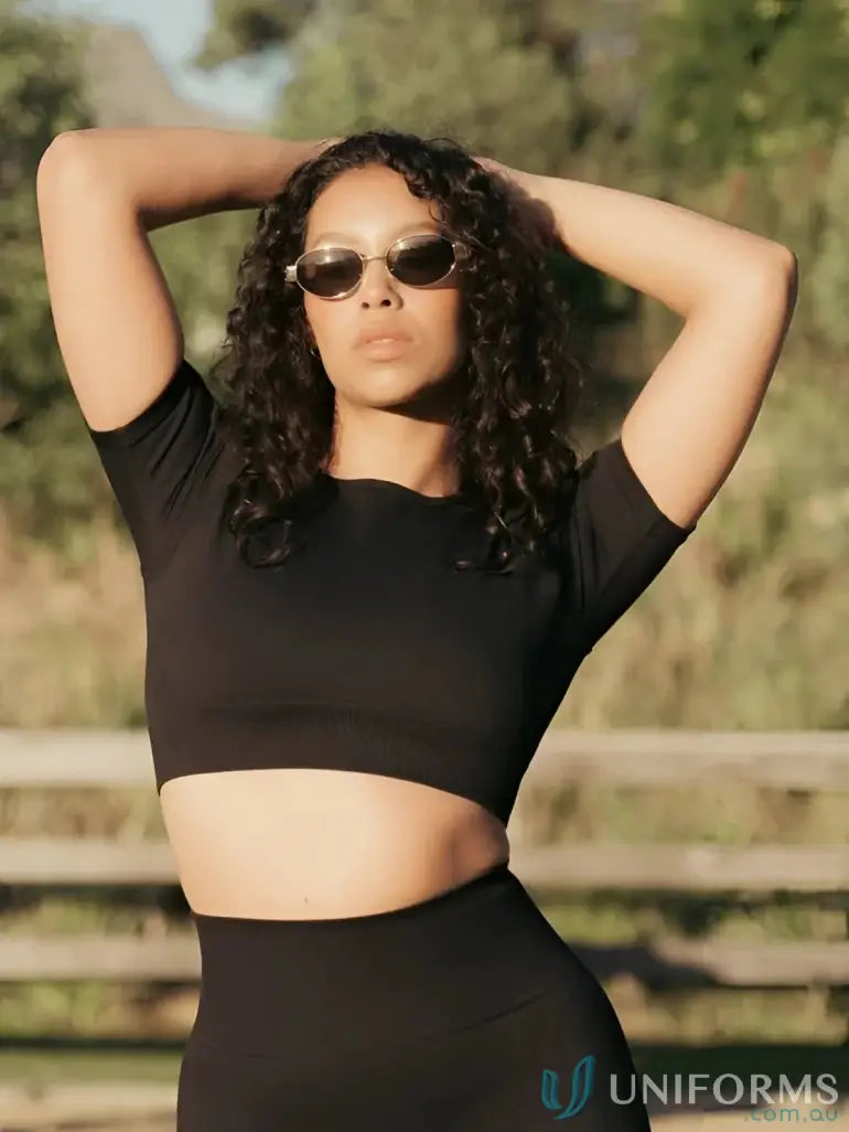 Woman in black seamless tee with round neck from Seamless Cropped Onyx Tee collection