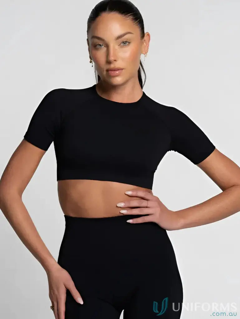 Black seamless tee and leggings set featuring a round neck cropped tee for workouts