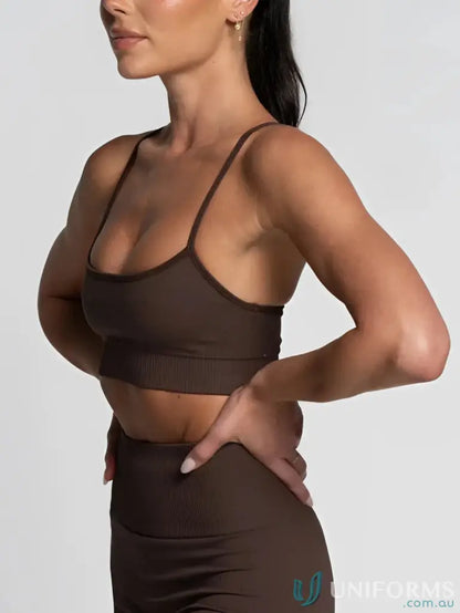 Brown ribbed athletic bra and leggings featuring a flattering scoop neckline for active wear
