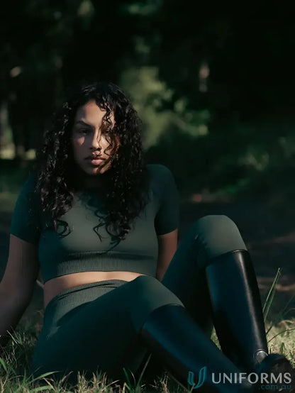 Woman in green Seamless Invicible Scrunch Emerald Leggings, perfect workwear or uniforms