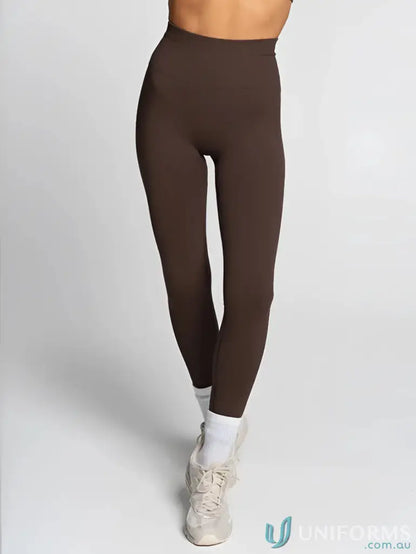Brown high-waisted leggings from Seamless Invisible Scrunch Espresso Leggings, ideal for uniforms or workwear