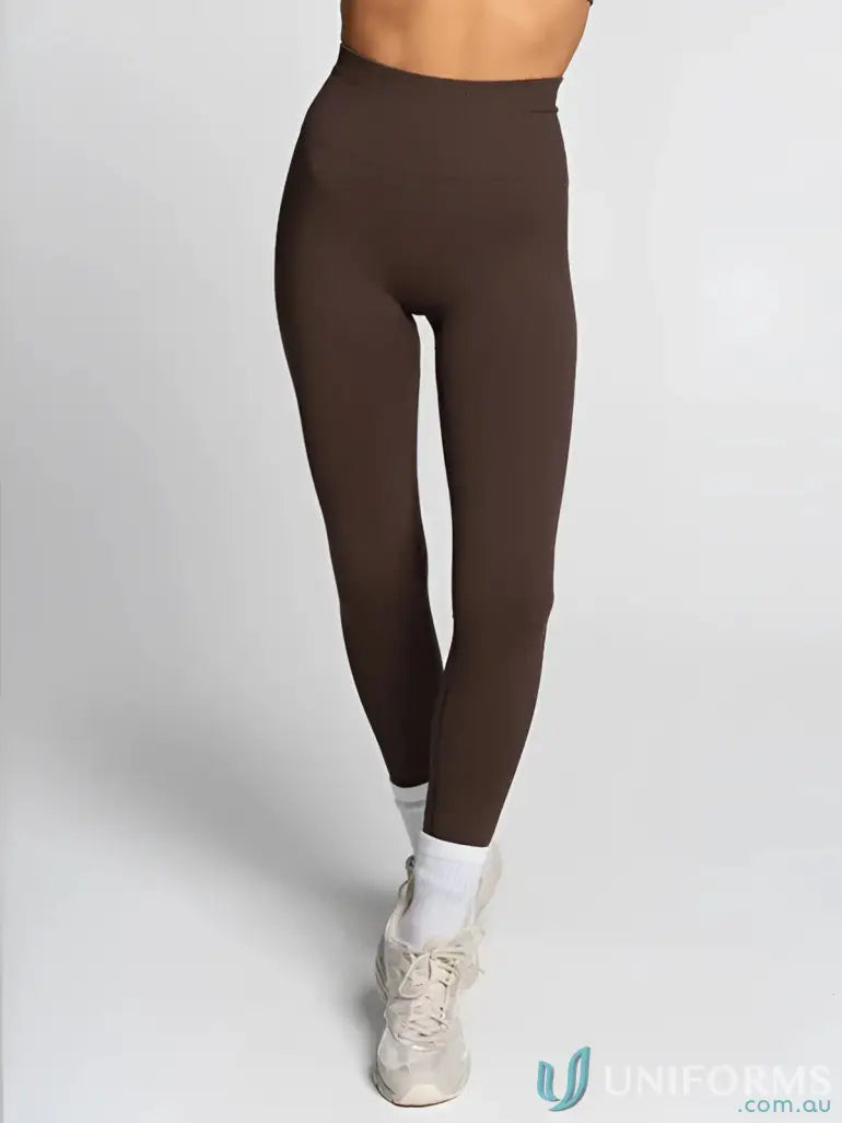 Brown high-waisted leggings from Seamless Invisible Scrunch Espresso Leggings, ideal for uniforms or workwear