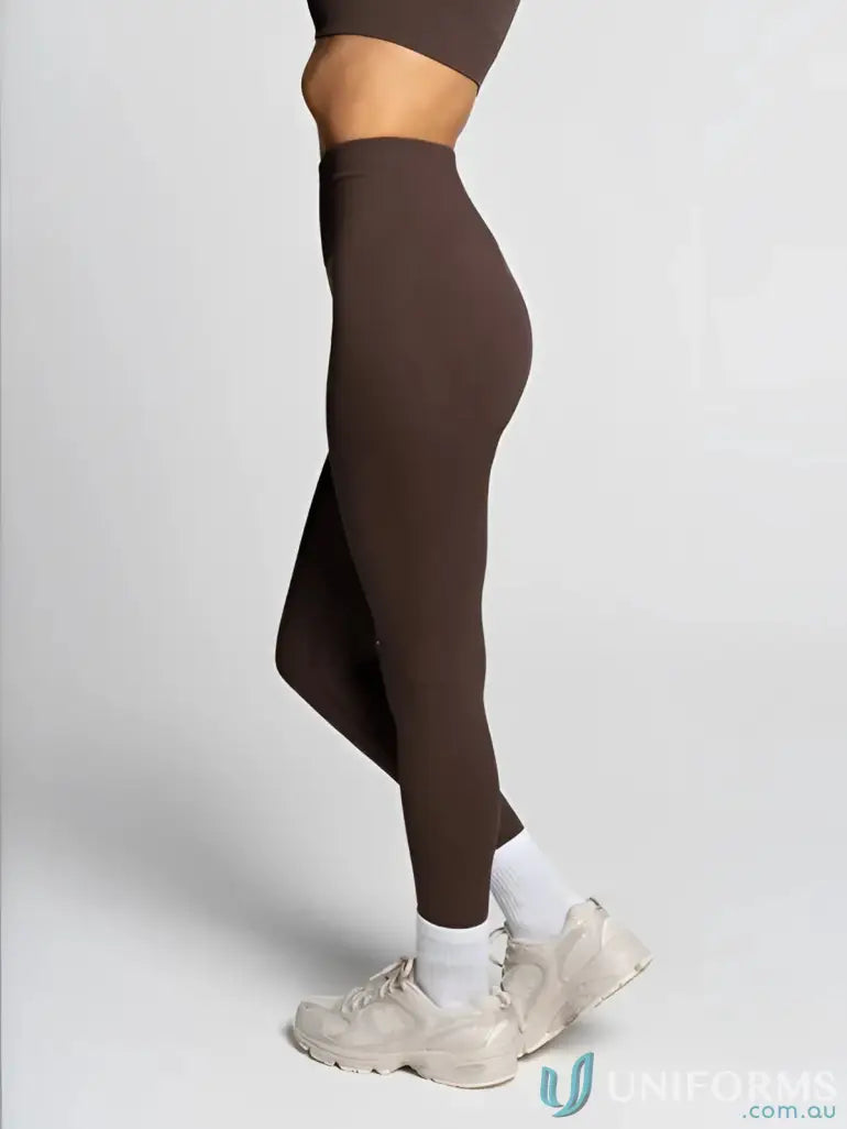 Brown Seamless Invicible Scrunch Espresso Leggings with white socks and sneakers for work uniforms