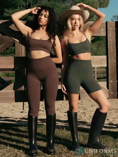 Two women in athletic wear and riding boots showcasing Seamless Invicible Scrunch Espresso Leggings, perfect work uniforms