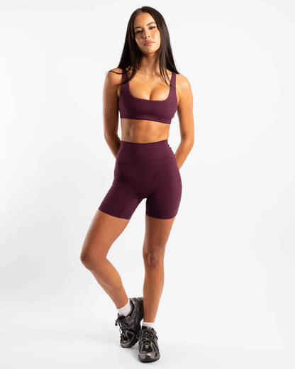 Burgundy seamless athletic set with Invicible Scrunch Onyx shorts