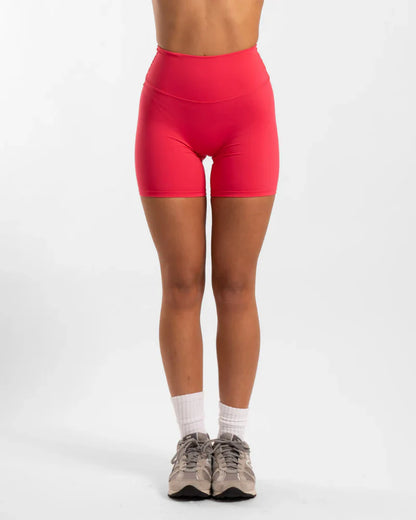 Red seamless invicible scrunch onyx shorts with mesh panels and white socks