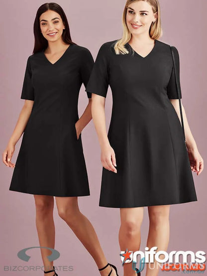 Two black Siena Extended short sleeve dresses displayed on a rack