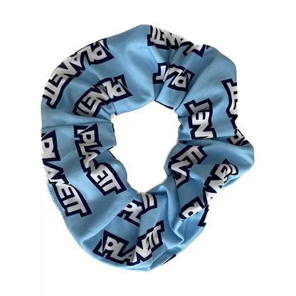Light blue sky scrunchie with planet text design on fabric