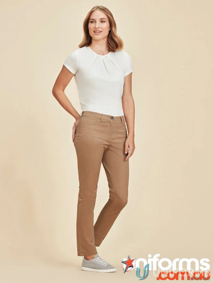 Woman wearing white top and khaki Slim Leg Traveller stretch chino pant RGP263L