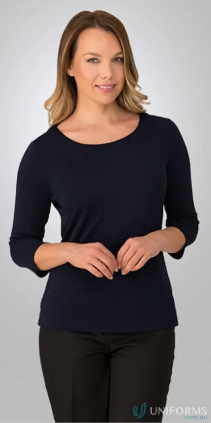 Woman in navy Smartknit Top and black pants showcasing comfy stretch workwear