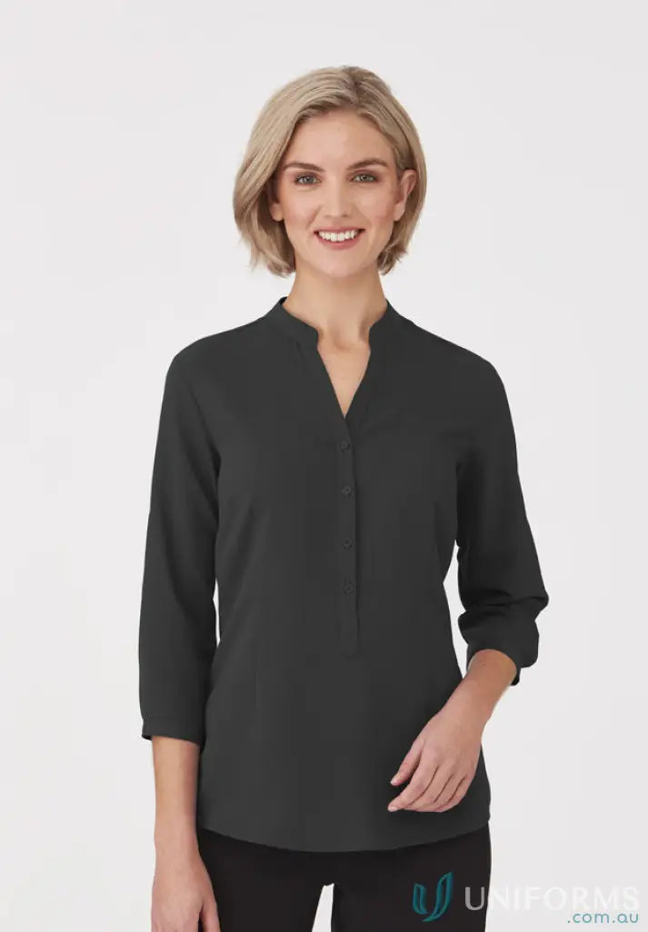 Woman wearing SoEzy Top in dark gray workwear, perfect for work uniforms