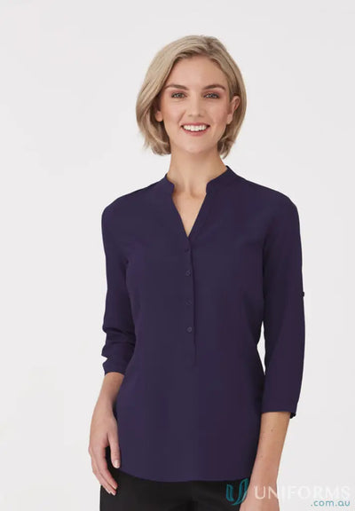 Woman wearing SoEzy Top dark purple collared blouse ideal for work uniforms or workwear