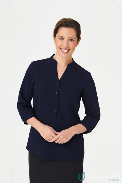 Woman wearing navy blue SoEzy Top workwear, perfect for work uniforms and uniforms